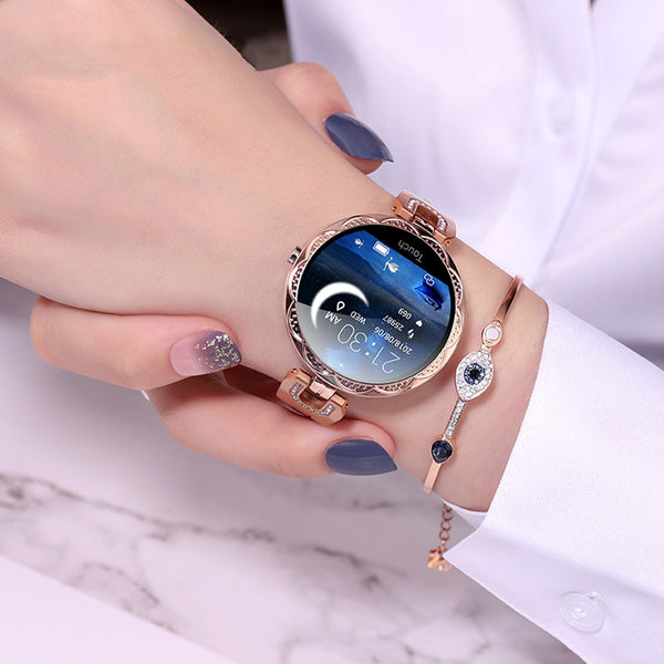 Smartwatch on a wrist with a marble background