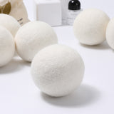 White laundry detergent balls on a white background