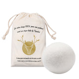 Wool dryer ball with branded drawstring bag on a white background