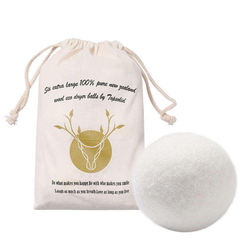 Wool dryer ball with branded drawstring bag on a white background