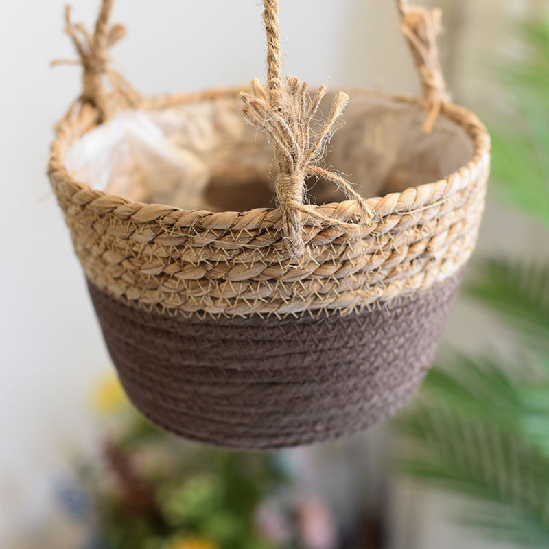 Woven hanging basket with a blurred green plant background