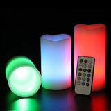 Color-changing LED candles with a remote control on a dark background