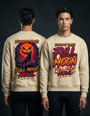 Two male models shown from the back and front wearing a cream-colored crewneck sweatshirt with a large Halloween graphic. The back features a spooky wolf and jack-o'-lantern design, while the front displays 'FULL MOON HOWL' in bold red and orange lettering.