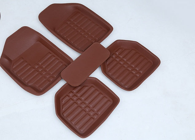 Black heavy-duty rubber car mats with deep channels for trapping dirt, mud, and water in vehicle footwells
