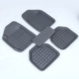Four gray car floor mats on a white background