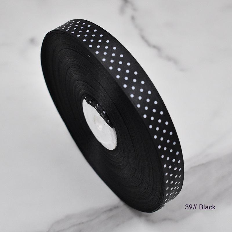 Handmade decorative bows featuring classic polka dot patterns on premium grosgrain ribbon for gift wrapping and accessories