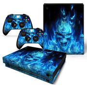 Gaming console and controllers with blue flame design on a white background