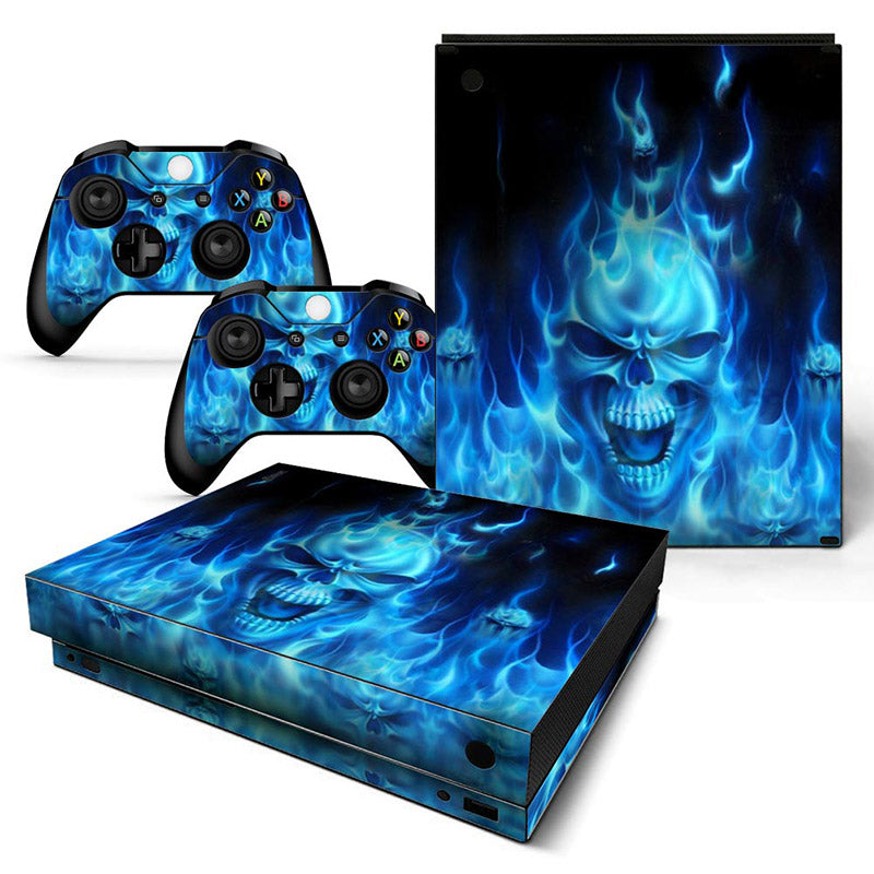 Gaming console and controllers with blue flame design on a white background