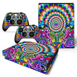 Colorful psychedelic design skin for a gaming console and controllers on a white background