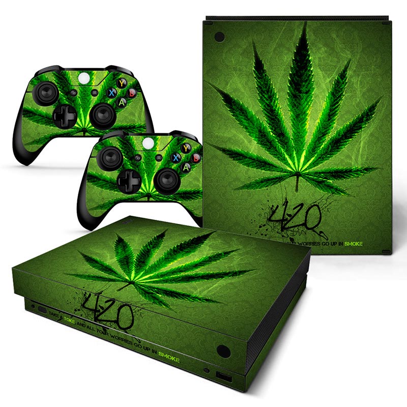 Gaming console and controllers with cannabis leaf design on a white background