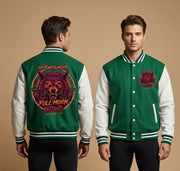 A man modeling a green and white varsity jacket from both the front and back against a solid beige background. The jacket features a green body with white sleeves, green and white striped ribbed collar, cuffs, and hem, and detailed graphic prints on the back and chest.